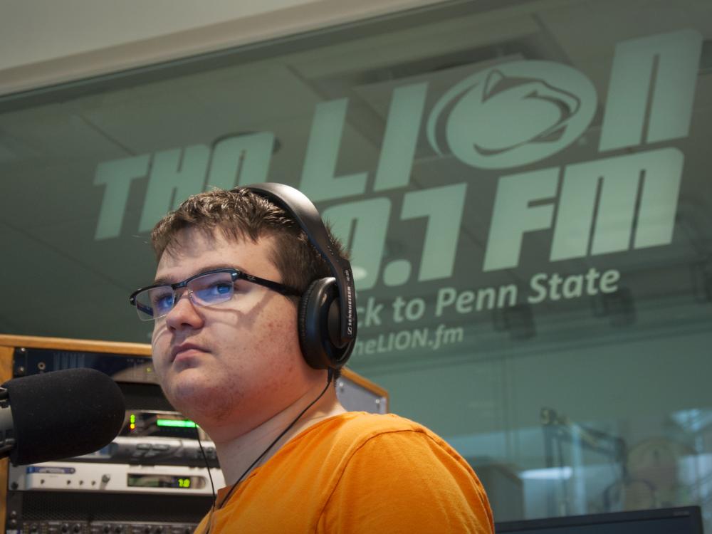 Alex Mellott at the Lion FM studio in the HUB