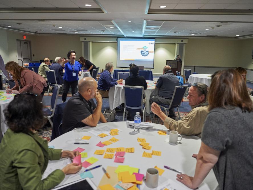 Group of people sitting around a table during workshop