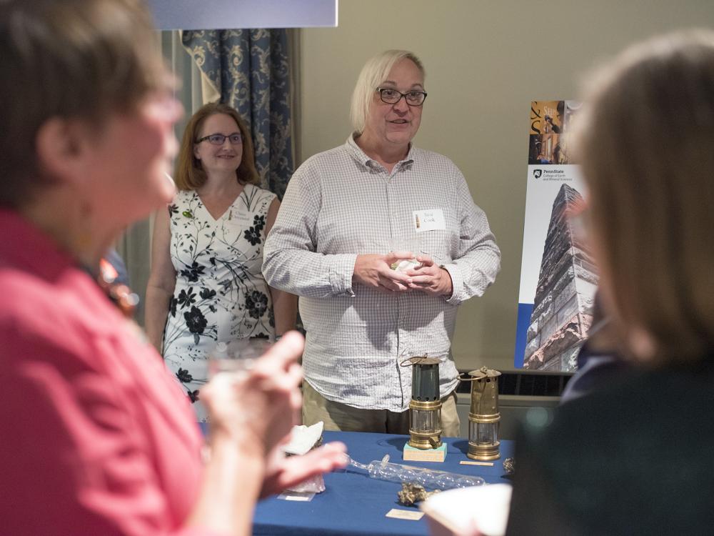 Jane Cook shows off a few pieces of the museum's vast mining lamps collection.