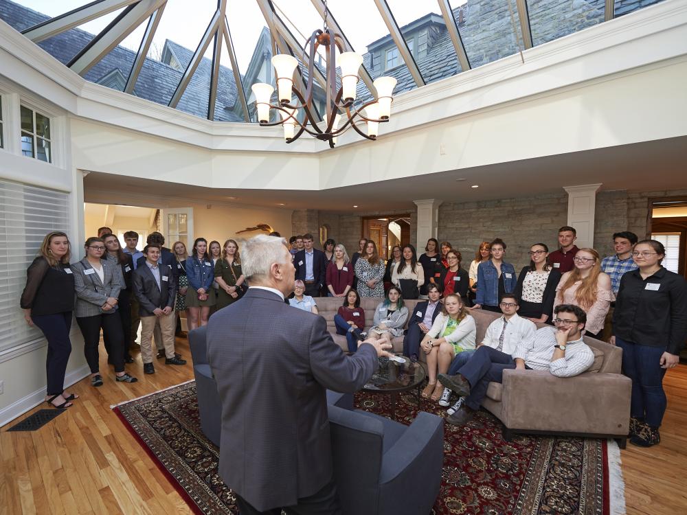 Photograph of Eric Barron addressing a room full of students