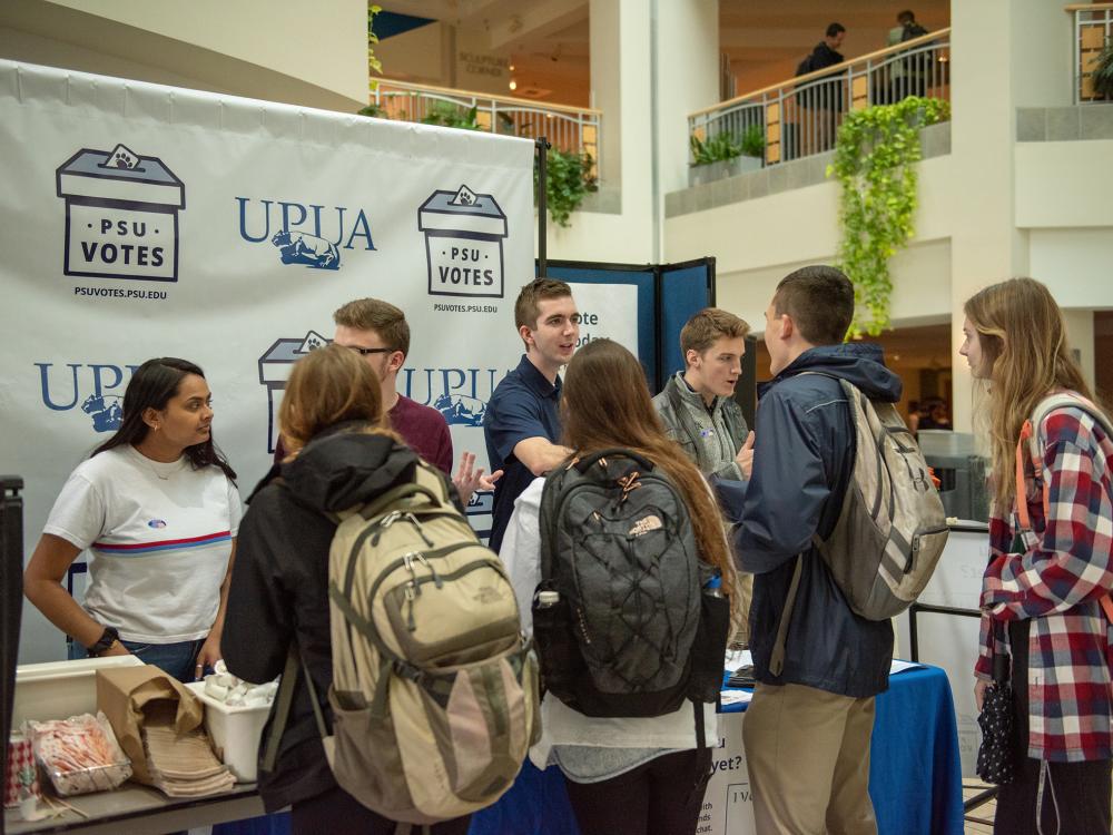 PSU Votes volunteers talking to students in the HUB