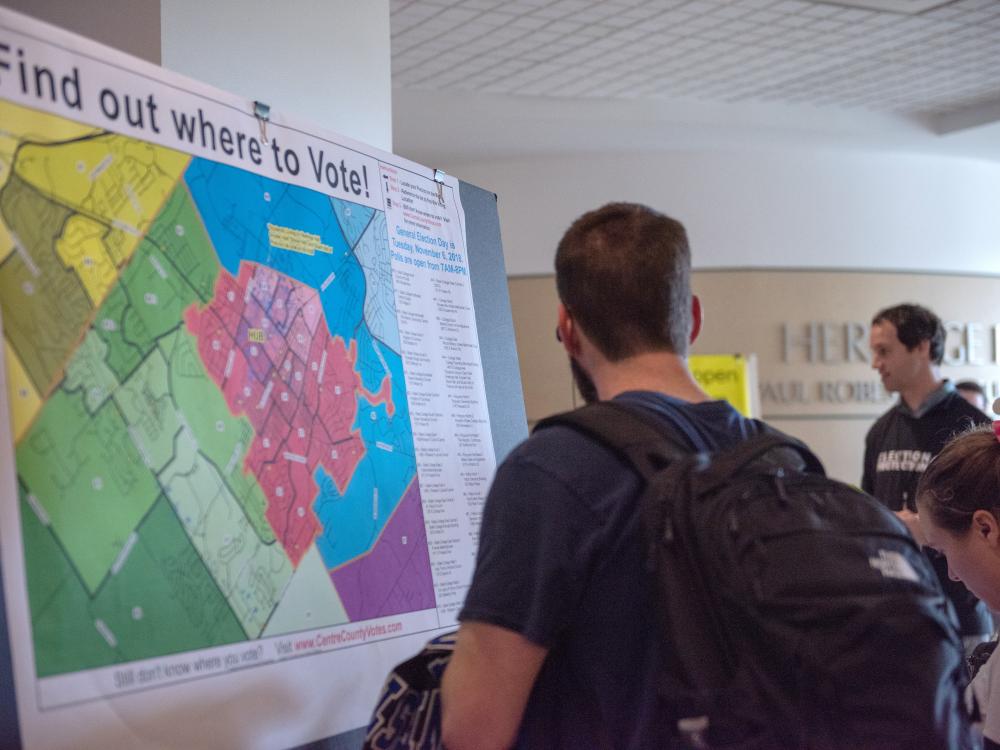 Students looking at a map of where to vote