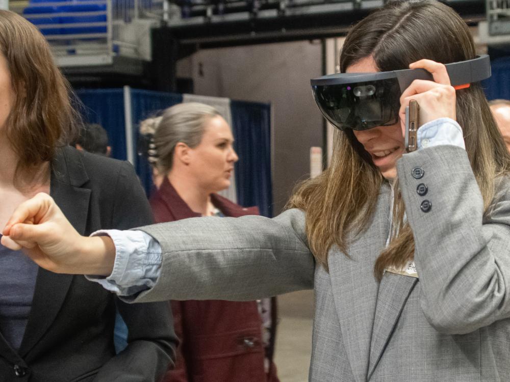 female student using VR googles 