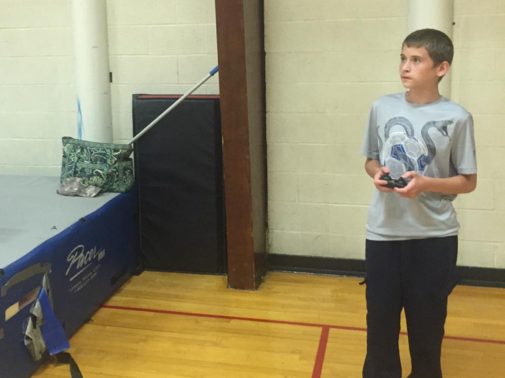 Donald Feathers maneuvers a Dromida KODU Quadcopter within Erie Hall. 