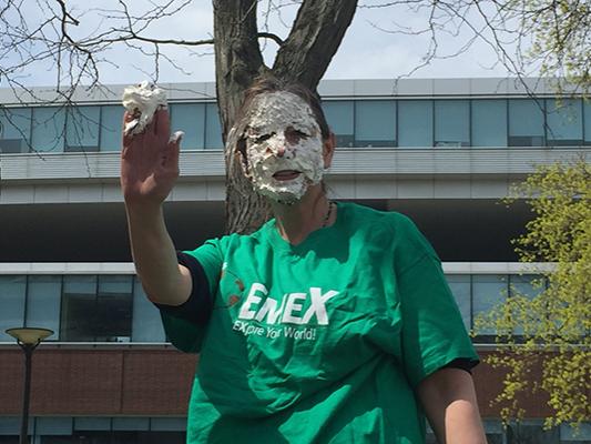 Marisa Ferger, a lecturer in meteorology, is covered with pie