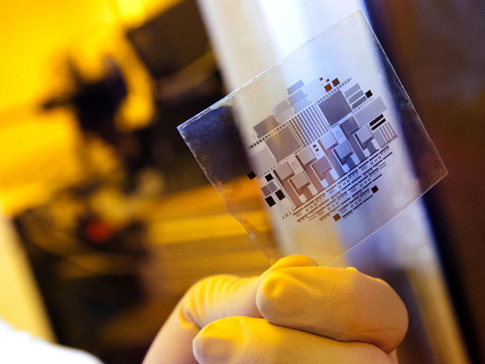 hand holding a square of flexible-circuit film