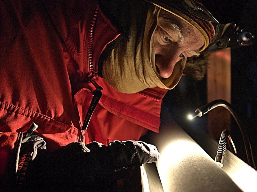 Senior research associate Don Voigt examines an ice core