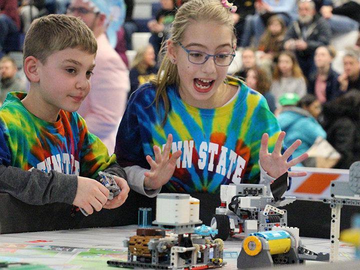 Smart Software team members Ryan Avram and Caylyn Hauser present their robot during the tournament.