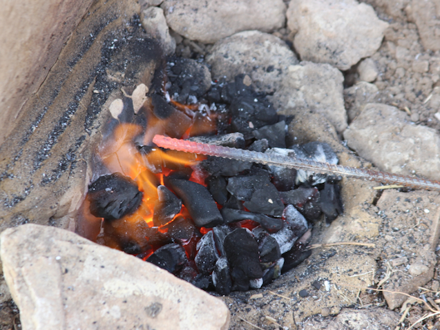 red-hot iron in the hearth
