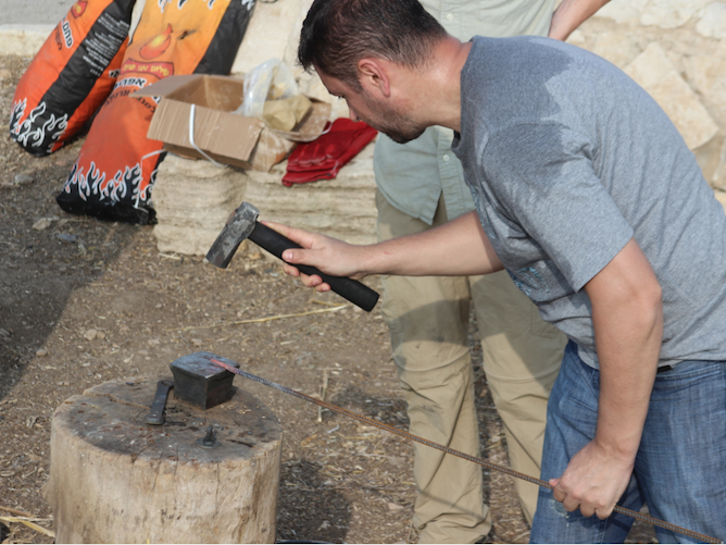 blacksmith forging iron