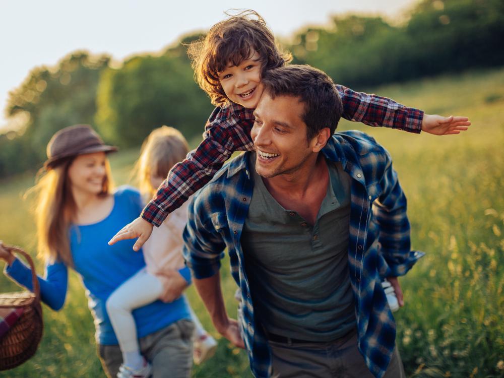 Man with family in field