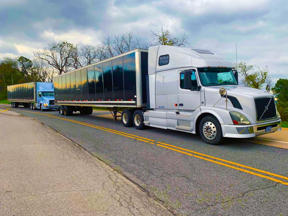 Two semi trucks operating as part of a platoon