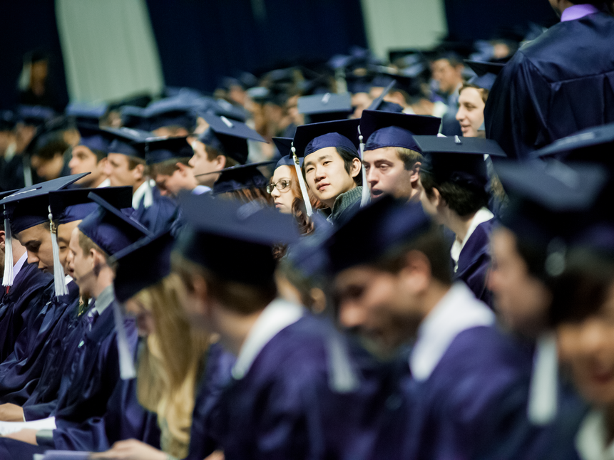 crowd of students in graduation caps and gowns