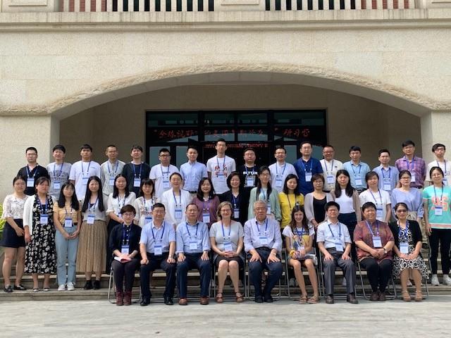 Amy Greenberg gathers for a group picture with seminar attendees at Fujian Normal University in China.