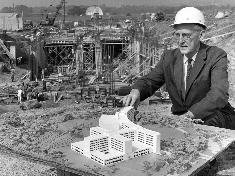 Dr. Harrell with model of Hershey and construction, 1966