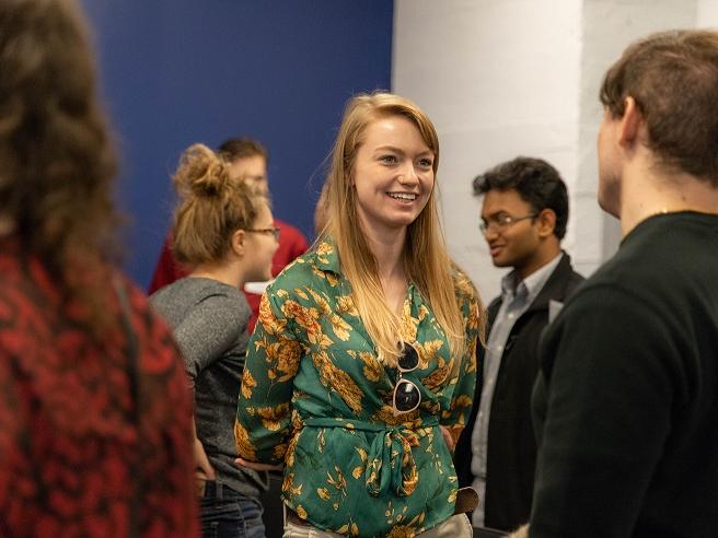 Female student speaks to another student