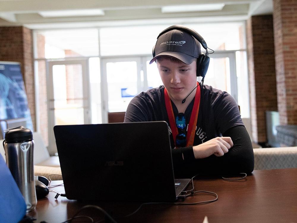 Mackinly Adams sits at laptop