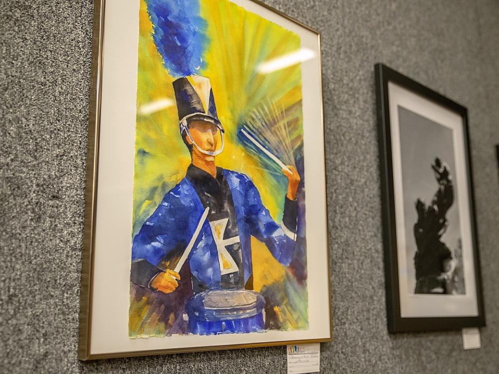 Watercolor painting of marching band drummer