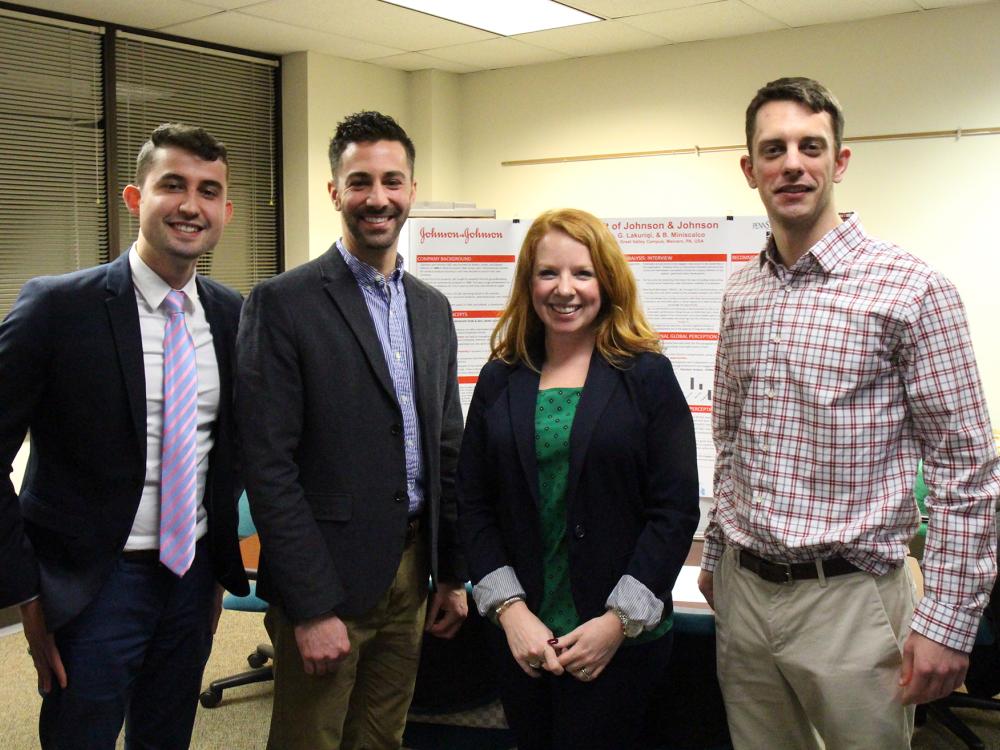 Penn State Great Valley graduate students stand in front of their audit poster