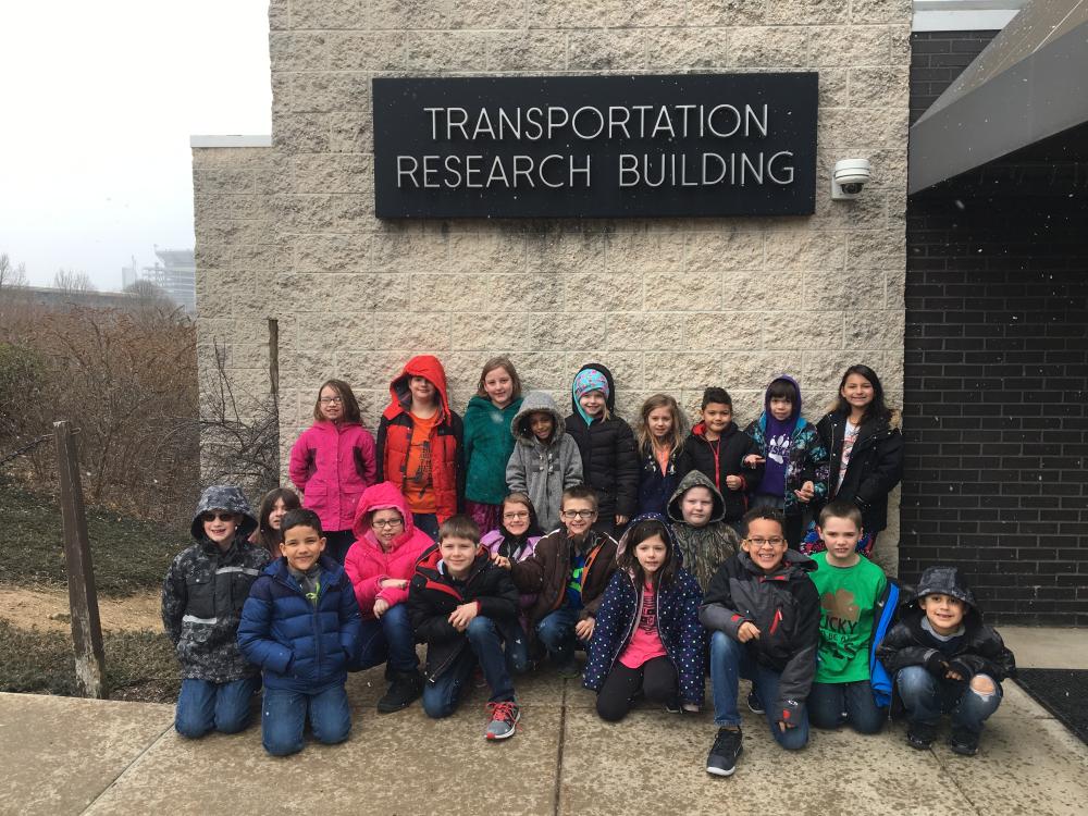 group photo of students standing outside Transportation Research Building