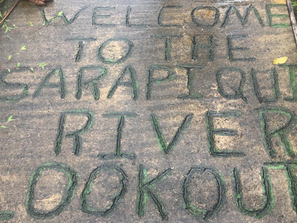 A message in the stone welcomes visitors to the Sarapiqui River lookout.