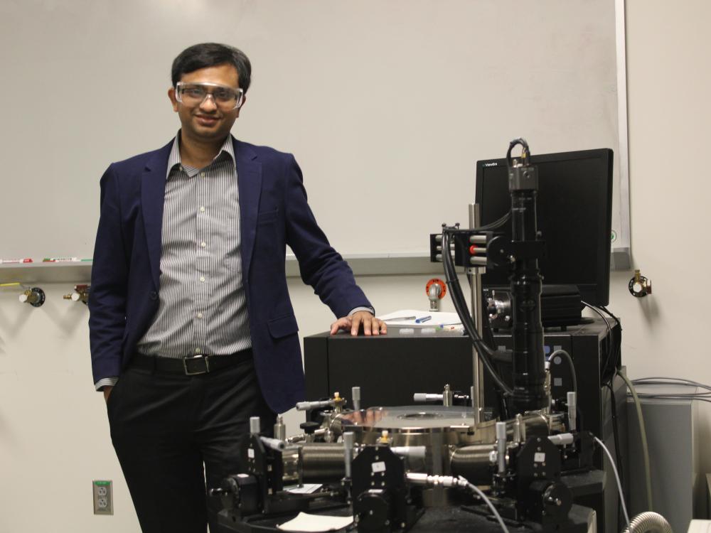 image of man in lab dressed in business casual attire.