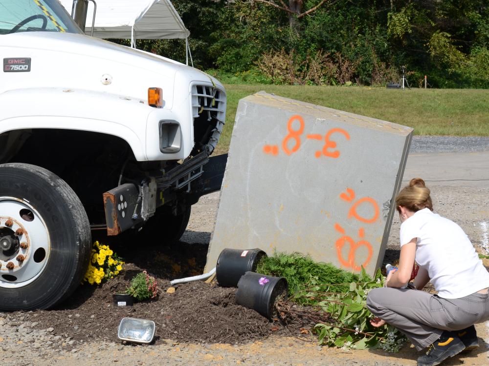A faculty member inspects the crash site.
