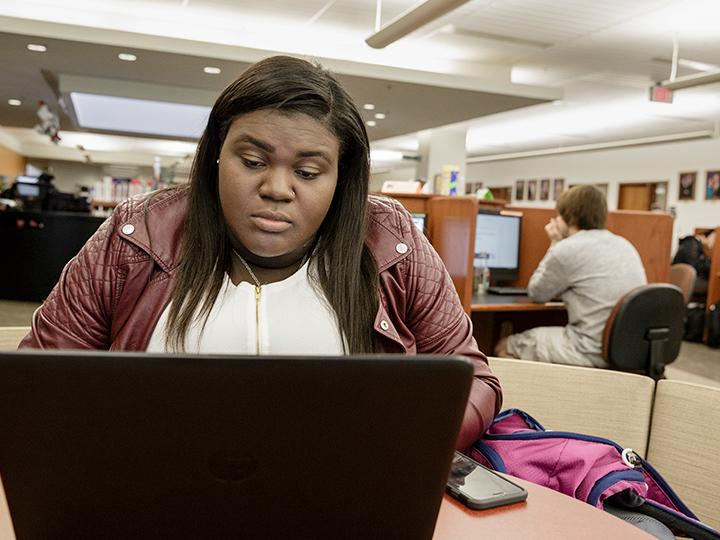 A student works in the Thun Library