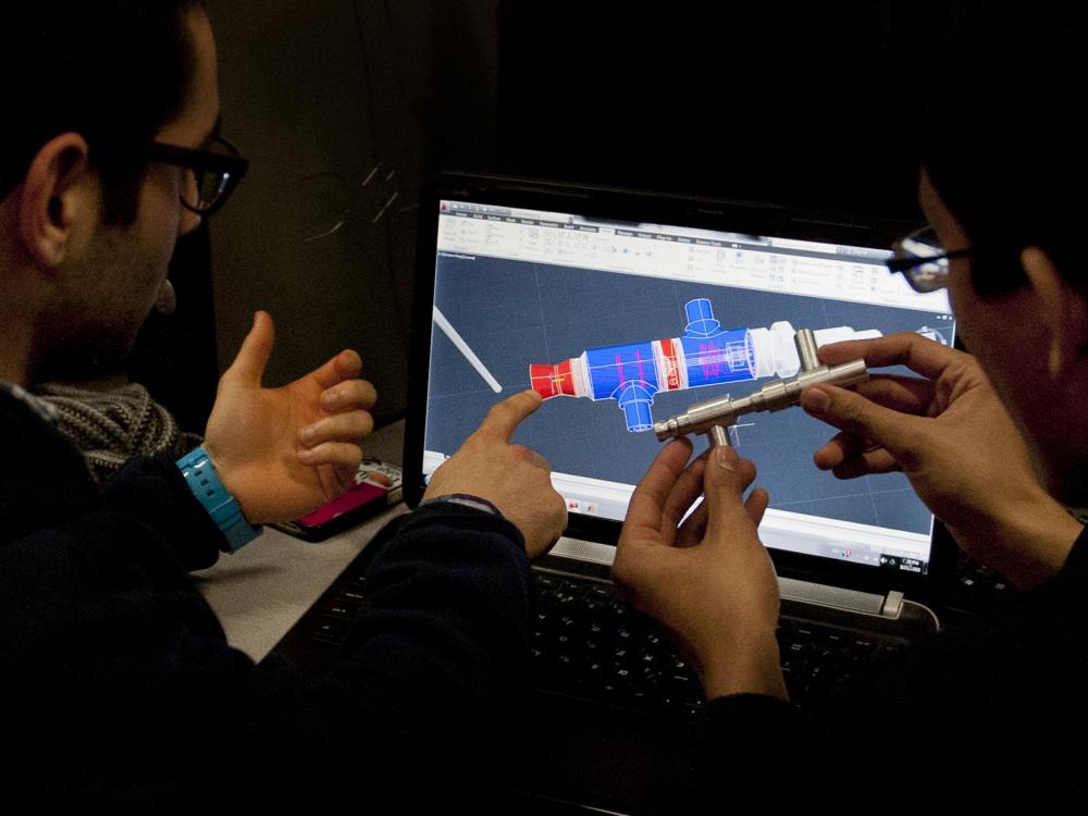 Lunar Lion Team examining rocket design
