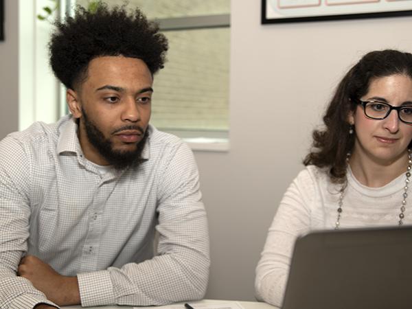 Jamar Dues (left) and Mary Budinsky (right) work together in a private tutoring room in the Student Success Center.