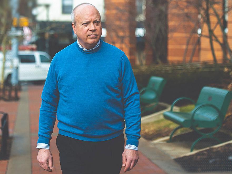 Penn State's Tom Sharbaugh walks in downtown State College.