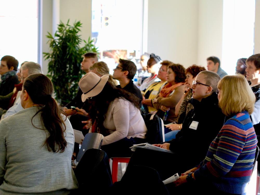 Participants at an entrepreneurial workshop look on