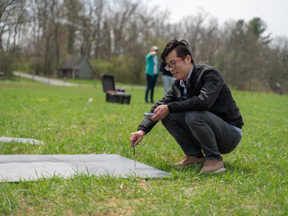 Postdoctoral scholar Jian Sun takes a thermal measurement of a target. 