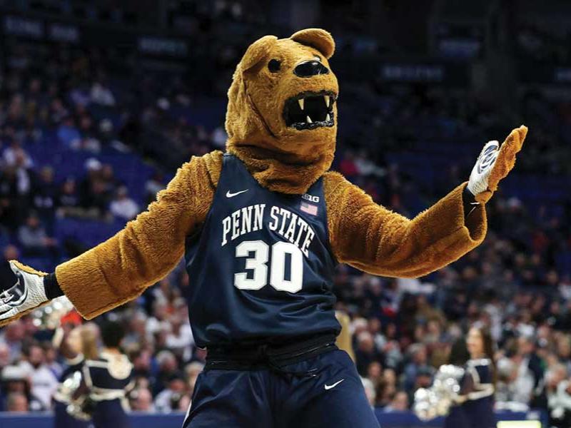 The Nittany Lion stands in front of a crowd during a basketball game at the Bryce Jordan Center.