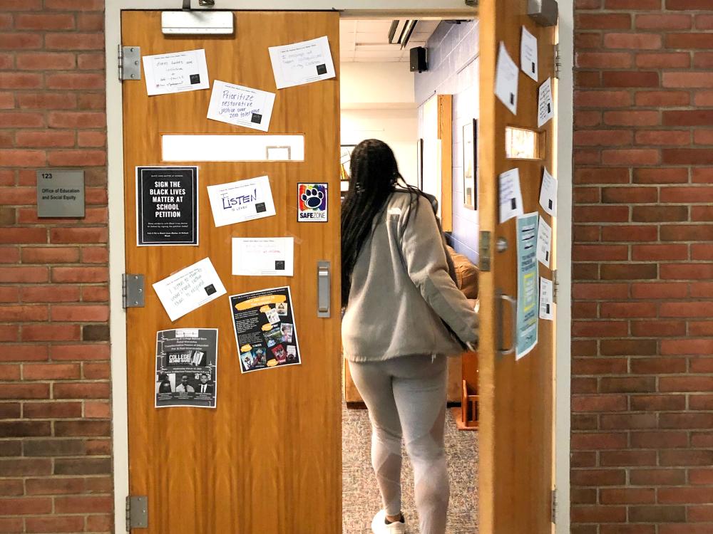 Student walking into the Office of Education and Social Equity