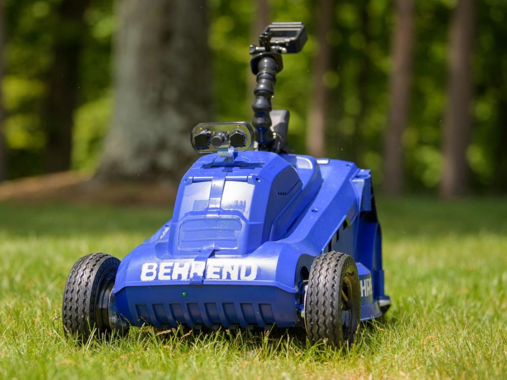 A close-up of the front of a remote-control lawn mower built by students at Penn State Behrend