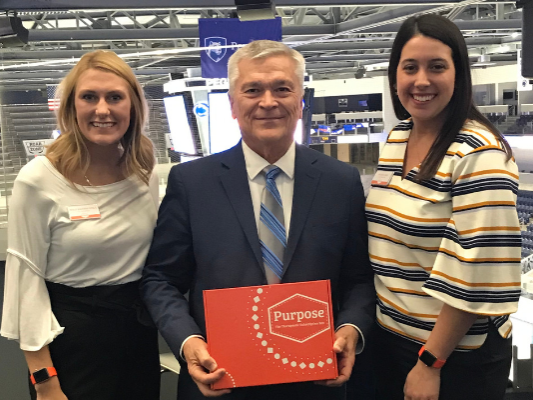 Penn State President Barron standing with student company founders of Purpose Therapy Box