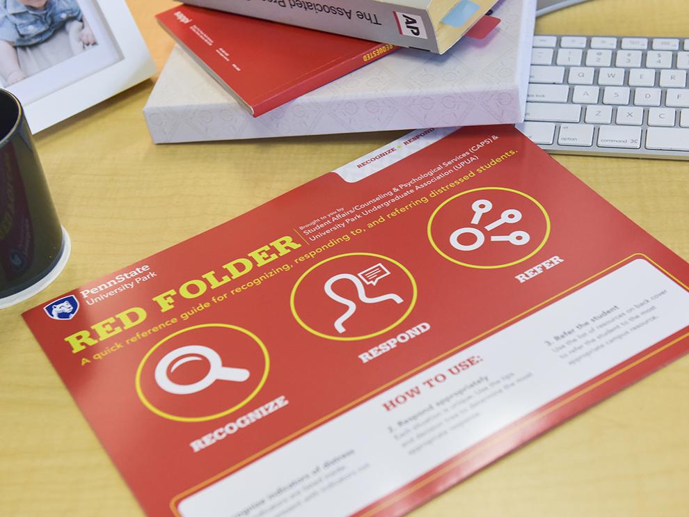 Red Folder sitting on desk
