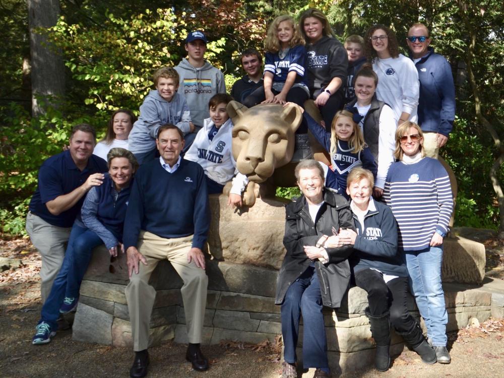 Chuck Schneider and his late wife, Enid, pictured with their children and grandchildren.