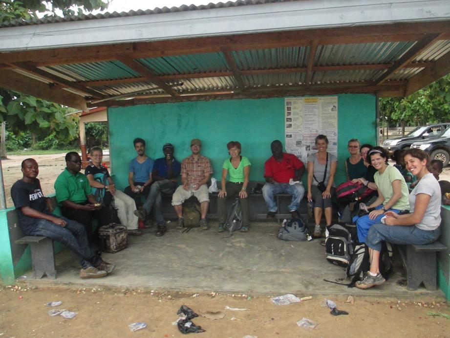 group of people sitting in a building in Africa