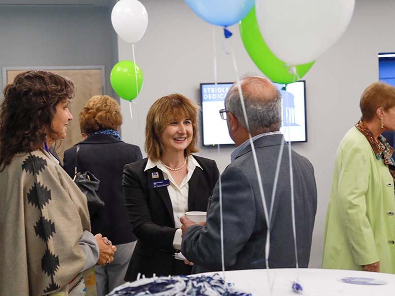 Victoria Sanchez, (left) associate dean for educational equity for the College of Earth and Mineral Sciences, and Susan Sinnott, head of the MATSE and Engineering Department, speak with Sarma Pisupati, chair of the Energy Engineering program