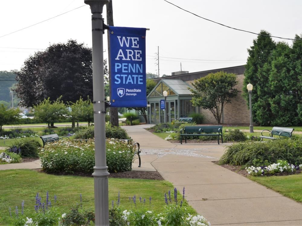 A Penn State Shenango banner on the campus's Pedestrian Mall area