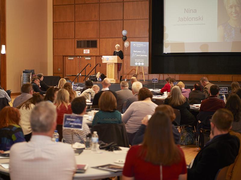 Faculty listen to speaker at engagement summit