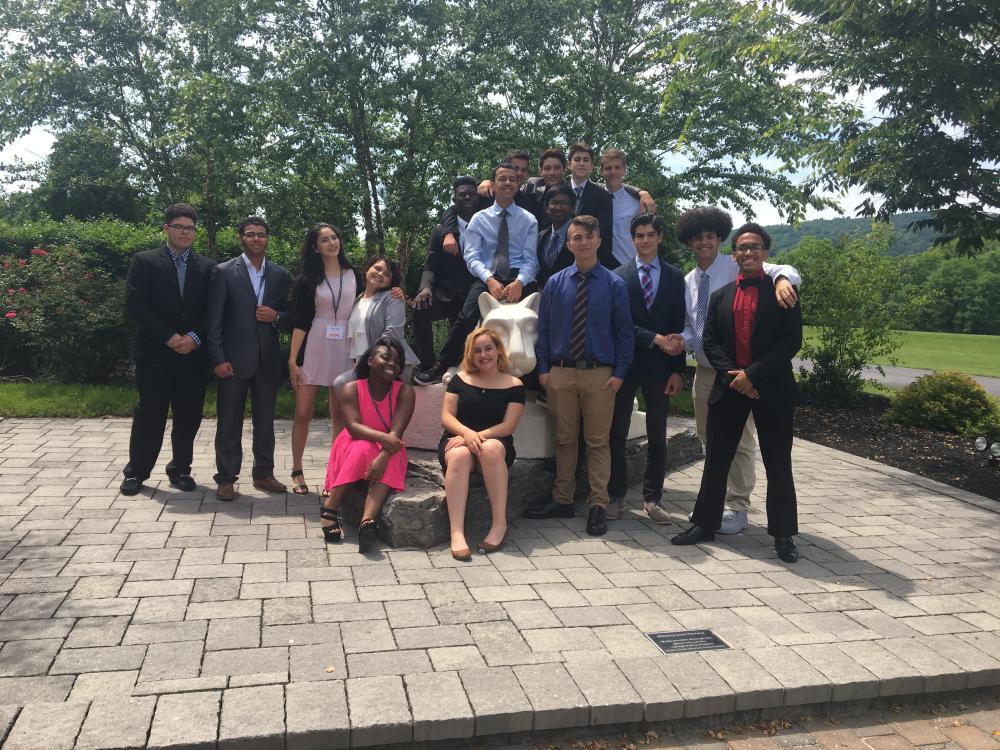 Group of students pose near Lion Shrine