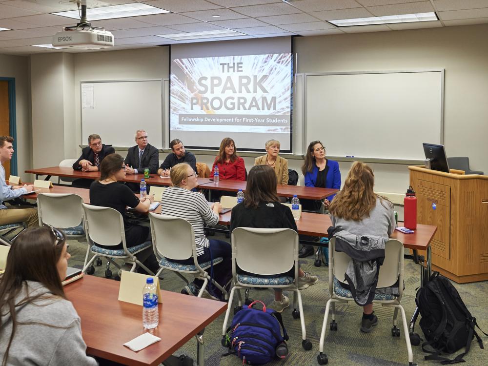 Caitlin Ting addresses students, administrators and faculty during a Spark Program workshop