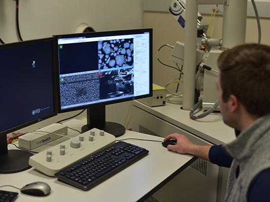 James White, a senior at Penn State, analyzes a metal sample