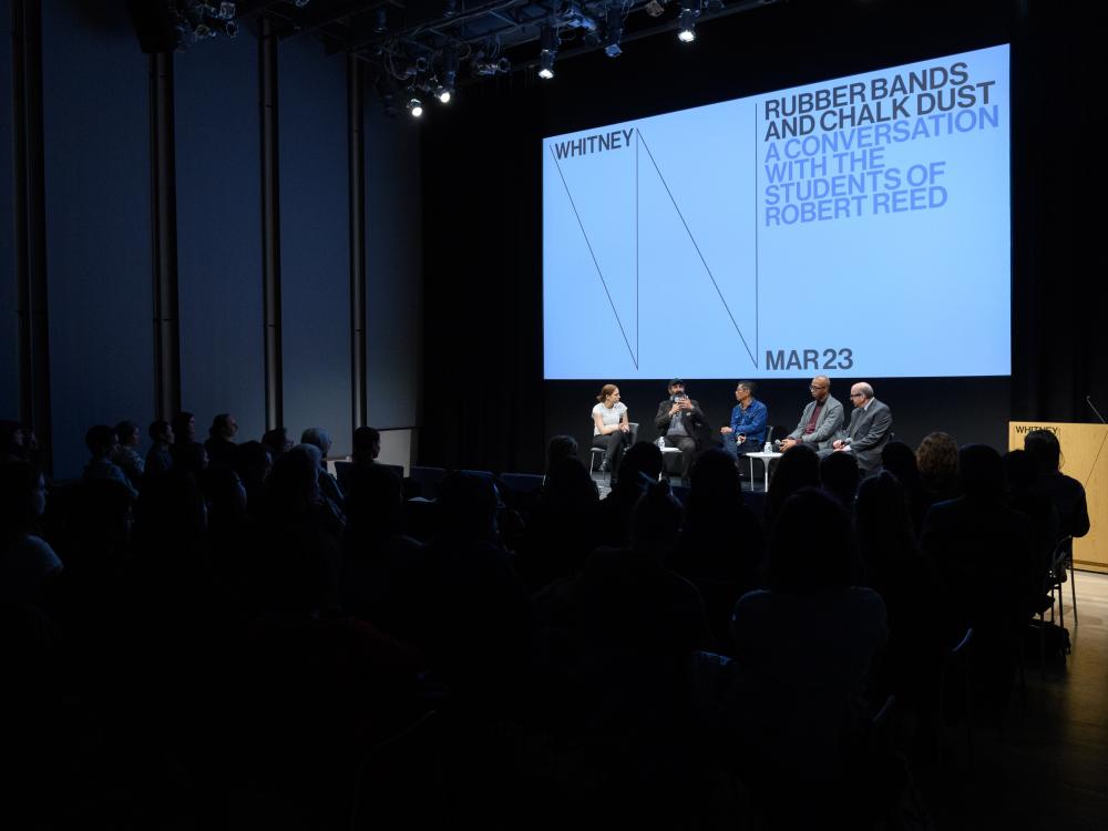 The view of a panel discussion featuring former students of Robert Reed at the Whitney Museum of Modern Art.