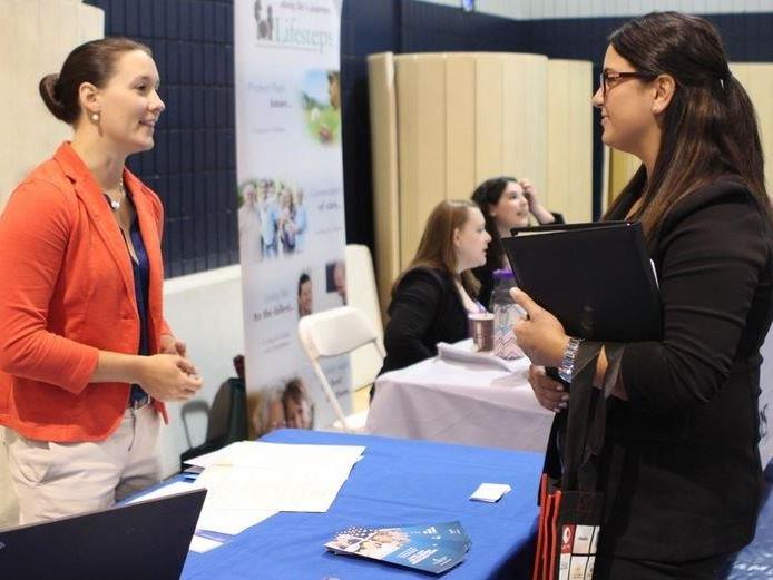 Job seeker speaks to potential employer at Alle-Kiski Job Fair