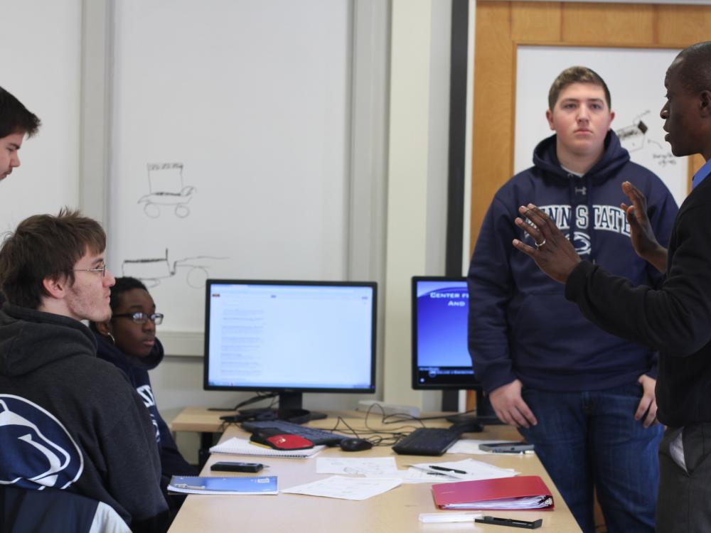 Conrad Tucker interacts with students