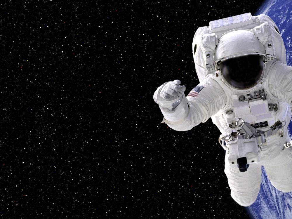 An astronaut floats in space.